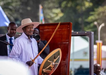 Uganda President Yoweri Museveni holds a ceremonial sword and shield during his swearing-in ceremony in Kampala amid growing debate over succession politics