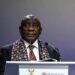 South African President Cyril Ramaphosa speaks at an international event podium during a public address on Africa and global development issues