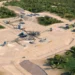 Aerial view rendering of the Ewoyaa lithium mine project in Ghana showing processing infrastructure, access roads and surrounding vegetation
