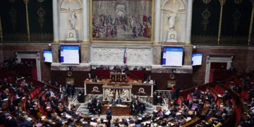 Members of France's National Assembly attend a parliamentary session in Paris as lawmakers vote to repeal the slavery-era Code Noir colonial laws