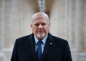 ICC Prosecutor Karim Khan posing at the International Criminal Court headquarters in The Hague