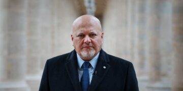 ICC Prosecutor Karim Khan posing at the International Criminal Court headquarters in The Hague