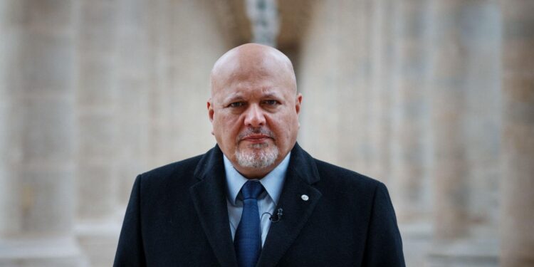 ICC Prosecutor Karim Khan posing at the International Criminal Court headquarters in The Hague