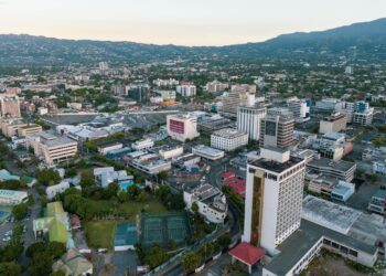 Aerial view of Kingston, Jamaica’s business district with office buildings, commercial centres and surrounding hills