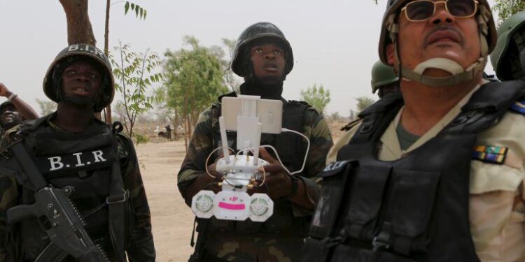 Nigerian troops in protective gear operate a drone during a security operation in northeastern Nigeria amid intensified anti-IS missions with US support