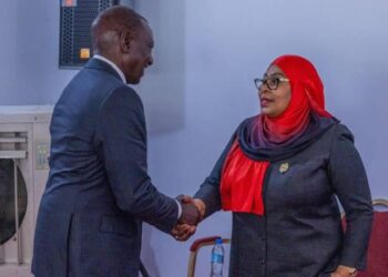 William Ruto shakes hands with Samia Suluhu Hassan during a formal meeting indoors