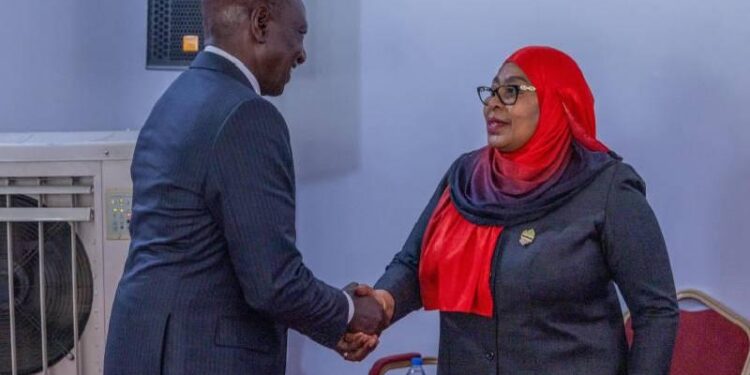 William Ruto shakes hands with Samia Suluhu Hassan during a formal meeting indoors