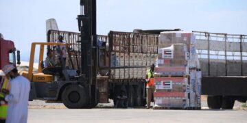 Humanitarian aid supplies are unloaded in Port Sudan as relief agencies navigate growing logistical and political pressures amid Sudan’s ongoing conflict