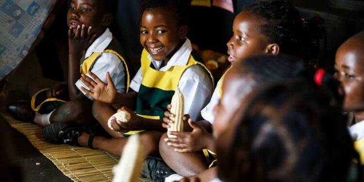Zimbabwean schoolchildren sit together during a classroom activity, reflecting community, identity and cultural connection in Harare