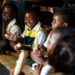 Zimbabwean schoolchildren sit together during a classroom activity, reflecting community, identity and cultural connection in Harare