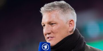 Bastian Schweinsteiger working as an ARD television pundit during Germany's World Cup match against Cote d'Ivoire