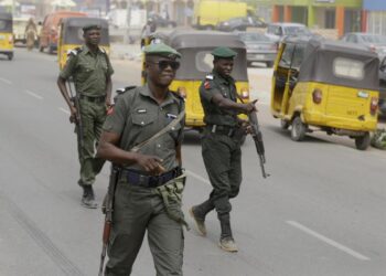 Nigerian Police Force officers patrol a public area as Nigeria debates the introduction of State Police and wider security reforms