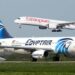 An EgyptAir aircraft taxis on a runway as an Ethiopian Airlines aircraft approaches for landing, illustrating growing air connectivity and competition in Africa's aviation sector