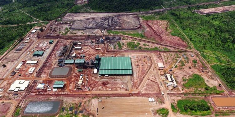 Aerial view of the Balama graphite mine and processing facility in northern Mozambique, showing industrial infrastructure surrounded by forested terrain