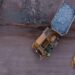 Aerial view of heavy haul trucks transporting mineral ore at a large-scale African mining operation, highlighting the continent's growing role in global critical mineral supply chains