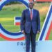 Kenyan President William Ruto stands in front of a large G7 summit installation in France, posing on a lawn during the 2026 gathering of world leaders