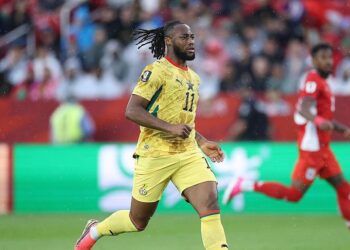 Antoine Semenyo of Ghana runs with the ball during a FIFA World Cup 2026 match, wearing the Black Stars' yellow number 11 jersey