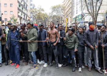 Demonstrators march through Johannesburg during a protest over undocumented migration in South Africa in April 2026
