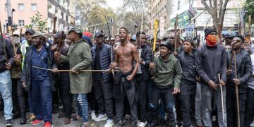 Demonstrators march through Johannesburg during a protest over undocumented migration in South Africa in April 2026