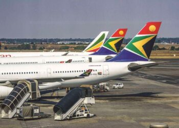 An African commercial airliner prepares for departure at an international airport as regional carriers experience rising passenger demand amid changing global flight routes