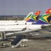 An African commercial airliner prepares for departure at an international airport as regional carriers experience rising passenger demand amid changing global flight routes