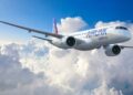 Airlink Embraer E195-E2 regional jet flying above clouds