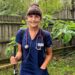 Alexandra Adams, the UK's first deafblind doctor, wearing medical scrubs during her clinical training