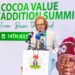 Senior officials and delegates stand during the Cocoa Value Addition Summit in Abuja