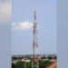 A telecommunications tower fitted with mobile network antennas in Ghana