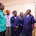 TVET trainees in blue workshop coats demonstrate technical equipment at Kenya Coast National Polytechnic in Mombasa