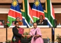 Namibian and South African officials exchange signed agreements as Presidents Netumbo Nandi-Ndaitwah and Cyril Ramaphosa look on in Pretoria