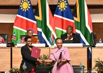 Namibian and South African officials exchange signed agreements as Presidents Netumbo Nandi-Ndaitwah and Cyril Ramaphosa look on in Pretoria