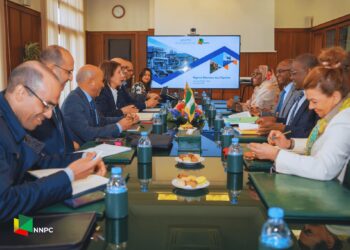 NNPC and ONHYM officials meet around a conference table as a screen displays the Nigeria-Morocco Gas Pipeline project