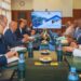 NNPC and ONHYM officials meet around a conference table as a screen displays the Nigeria-Morocco Gas Pipeline project