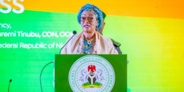 Oluremi Tinubu speaks beside officials at the community food bank commissioning in Lokoja