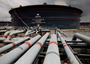 Pipelines lead towards a Dangote crude-oil storage tank at the Ibeju-Lekki refinery complex in Lagos, Nigeria