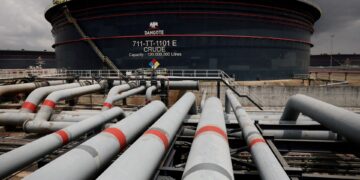 Pipelines lead towards a Dangote crude-oil storage tank at the Ibeju-Lekki refinery complex in Lagos, Nigeria