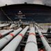 Pipelines lead towards a Dangote crude-oil storage tank at the Ibeju-Lekki refinery complex in Lagos, Nigeria