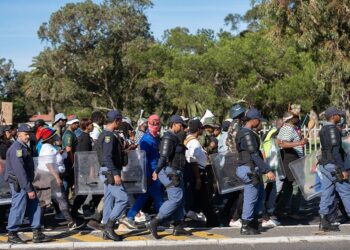 South African police officers stand in riot gear during anti-migrant protests in Cape Town as authorities respond to nationwide demonstrations