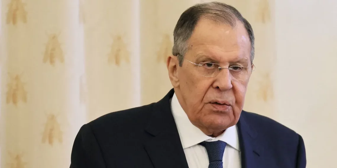 Sergey Lavrov, wearing glasses and a dark suit, speaks during a formal meeting in Moscow