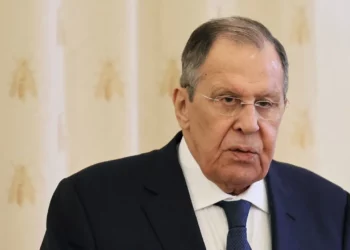 Sergey Lavrov, wearing glasses and a dark suit, speaks during a formal meeting in Moscow