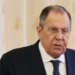 Sergey Lavrov, wearing glasses and a dark suit, speaks during a formal meeting in Moscow