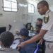 South African Home Affairs officials processing immigration documents inside a mobile office in Durban