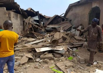 Residents inspect damaged buildings after US airstrikes targeting ISIS-linked militants in Offa, Kwara State, Nigeria, in December 2025