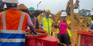 Small-scale mining trainees observe mercury-free gold-processing equipment at a mine site in Ghana’s Western Region