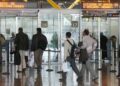 Passport control signs and traveller lanes at Madrid-Barajas Airport in Spain