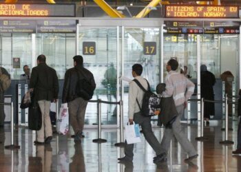 Passport control signs and traveller lanes at Madrid-Barajas Airport in Spain